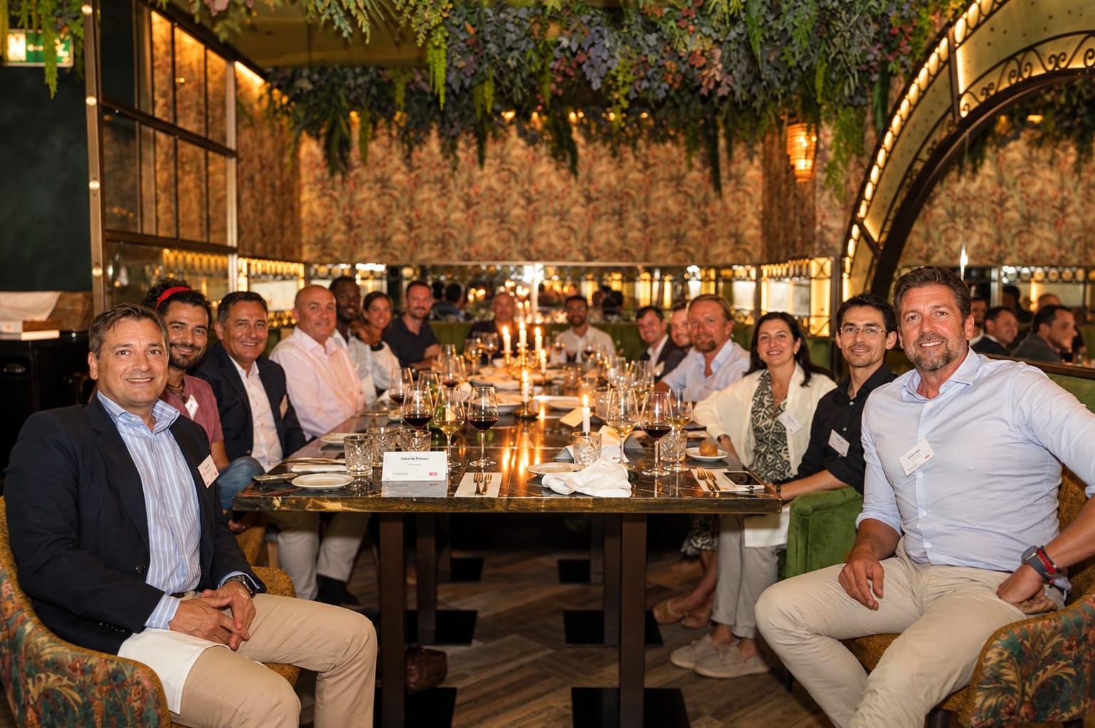 Executives seated together around a dinner table.